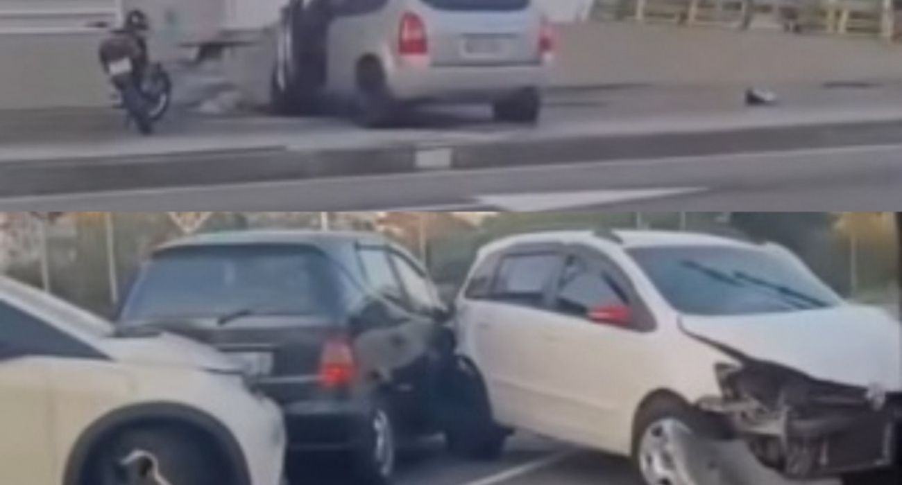 Carro caído na calha do BRT após acidente na Avenida das Américas