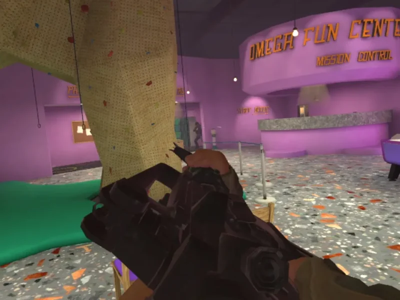 Cena de Airsoft Allstars em primeira pessoa mostra jogador com equipamento virtual de airsoft dentro de uma arena colorida chamada Omega Fun Center.