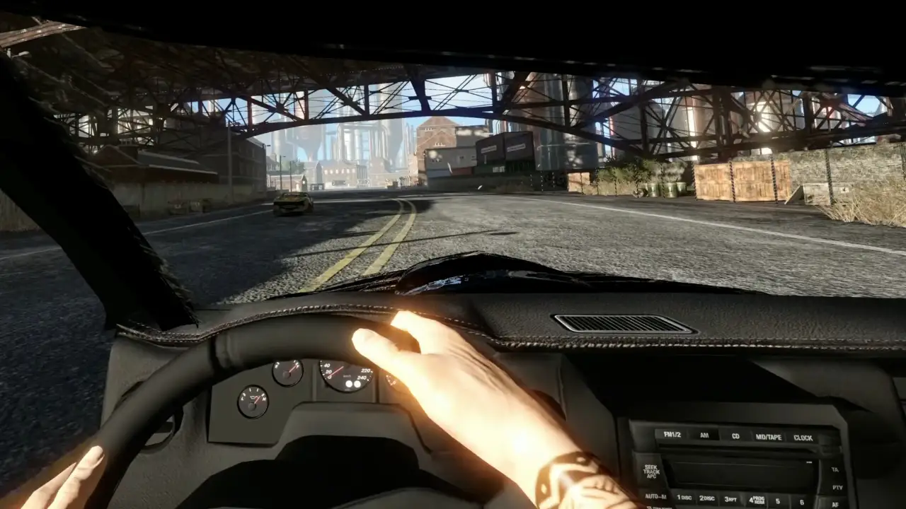 Visão em primeira pessoa de FlatOut 4 VR mostra mãos do motorista no volante de um carro que percorre uma avenida sob uma estrutura metálica. Visão em primeira pessoa de FlatOut 4 VR mostra mãos do motorista no volante de um carro que percorre uma avenida sob uma estrutura metálica.